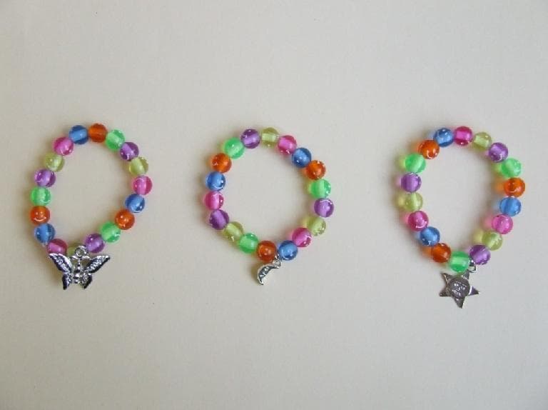 Children's Happy Charm Bracelets and Football Rings - Image 1