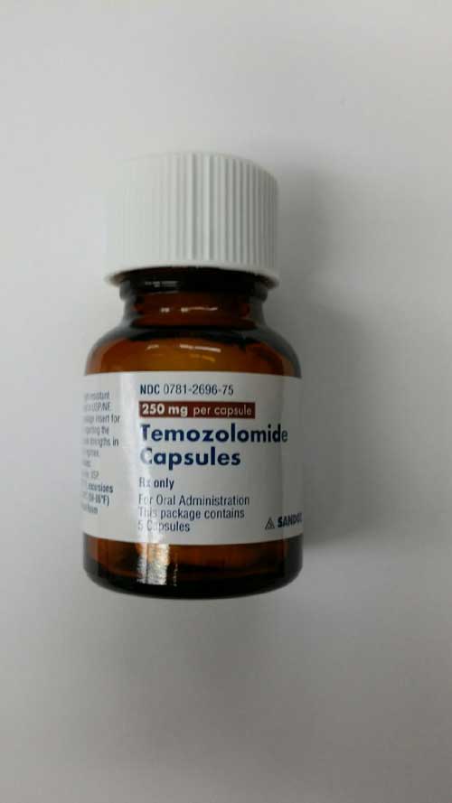 Bottles with cracked caps containing Temodar® (Temozolomide) and Temozolomide (generic) capsules - Image 2